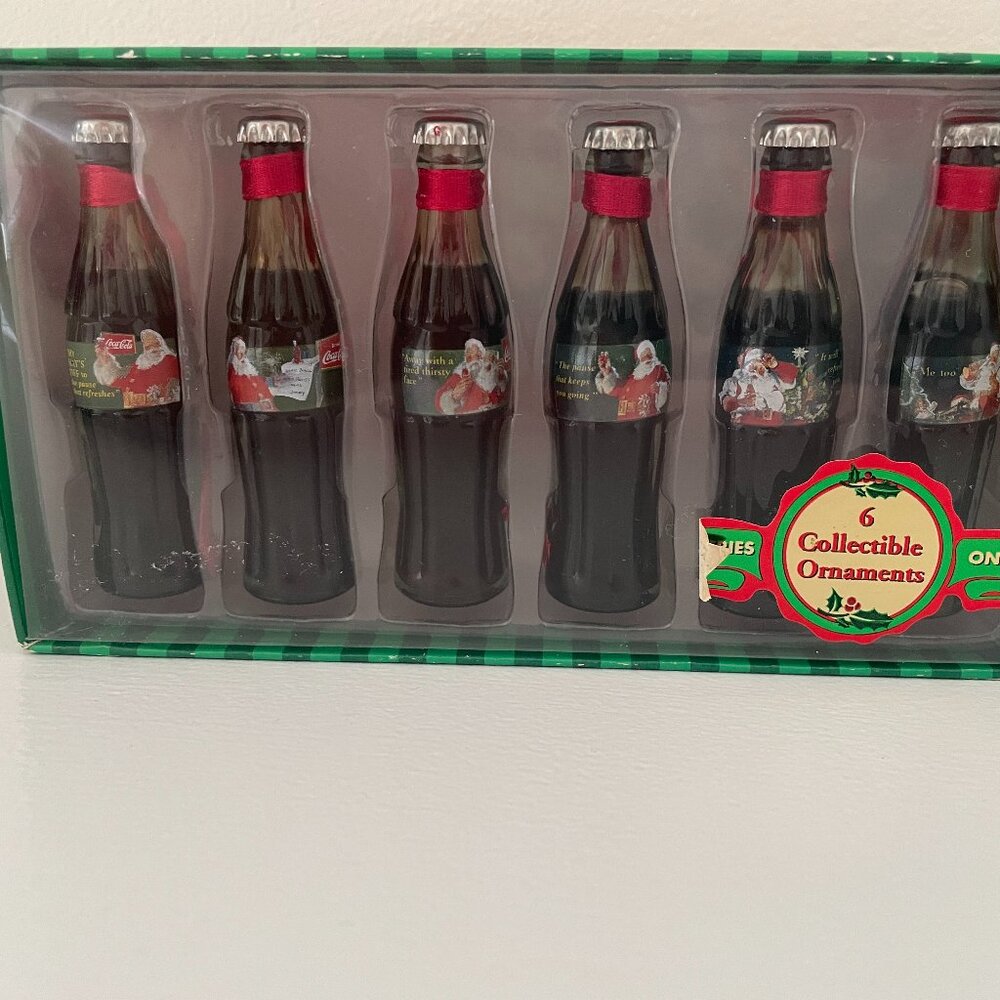 Coca Cola Evolution of Santa 6 piece Mini Glass Bottles